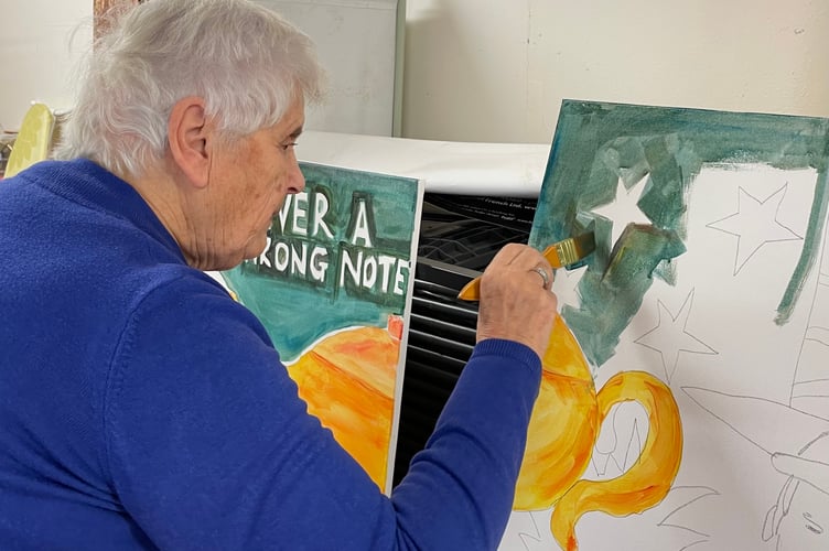 Viv Wilson MBE contributes to the Teignmouth Players diamond anniversary mural