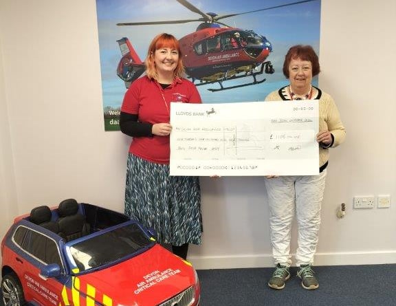 A representative from the Women's Challenge Club presents a cheque to Devon Air Ambulance - thankfully its services were never required by members of the club in the 30 years it ran outdoor activities