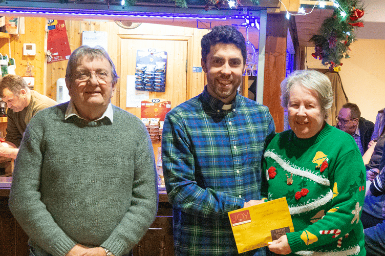 Frank & Carol Waister presenting the cheque to Rev. David Wilkie from St Nectan's Church