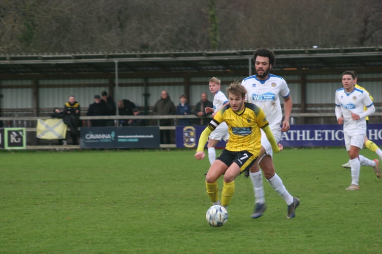 Ben Carter in possession for Buckland Athletic