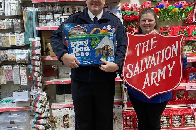 SALLY ARMY NA appeal Major Nigel Byrne, the local leader of The Salvation Army with Sharon, the manager of the Newton Abbot branch of The Works