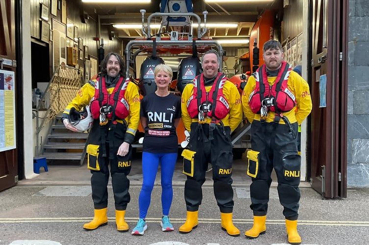 Volunteers at Teignmouth RNLI are supporting Anne Steele Arnett as she prepares for her second London Marathon L-R: Andy Case, Anne Steele Arnett, Sean Bromfield and James Stoyle.