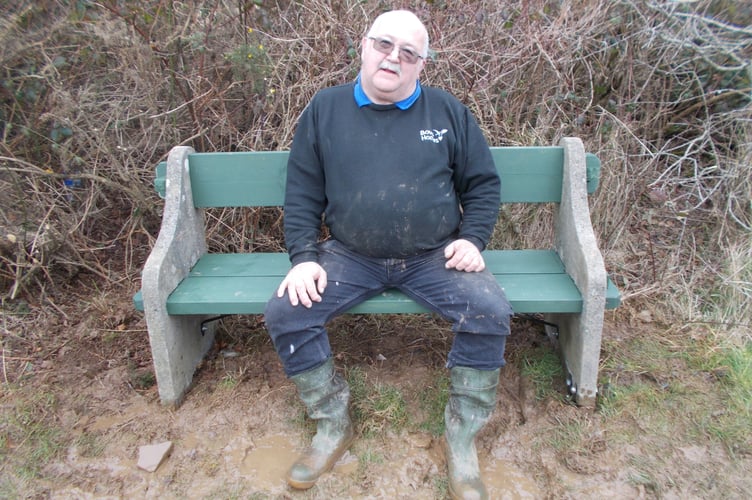 Bob Harris on his repaired bench in Chudleigh Knighton