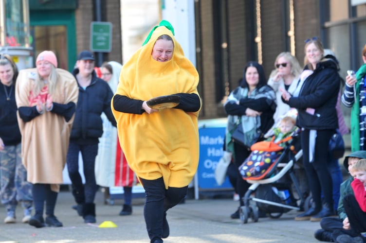 A day at the races.  Pancake Day racing in Newton Abbot's Market Square from the youngsters of Wolborough C of E Primary School