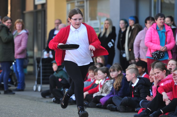 A day at the races.  Pancake Day racing in Newton Abbot's Market Square from the youngsters of Wolborough C of E Primary School